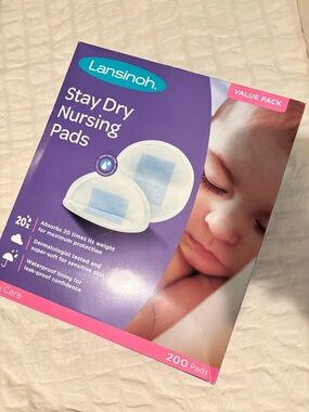 Bundle of change pad and Lansinoh Stay Dry Nursing Pads